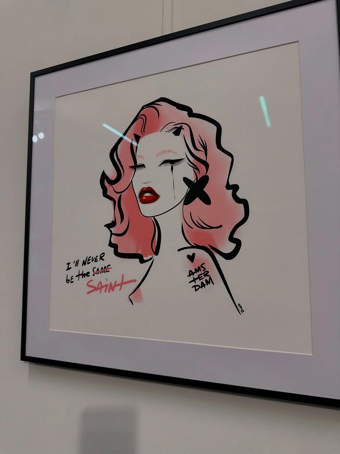 I Will Never Be a Saint framed on the exhibition wall.